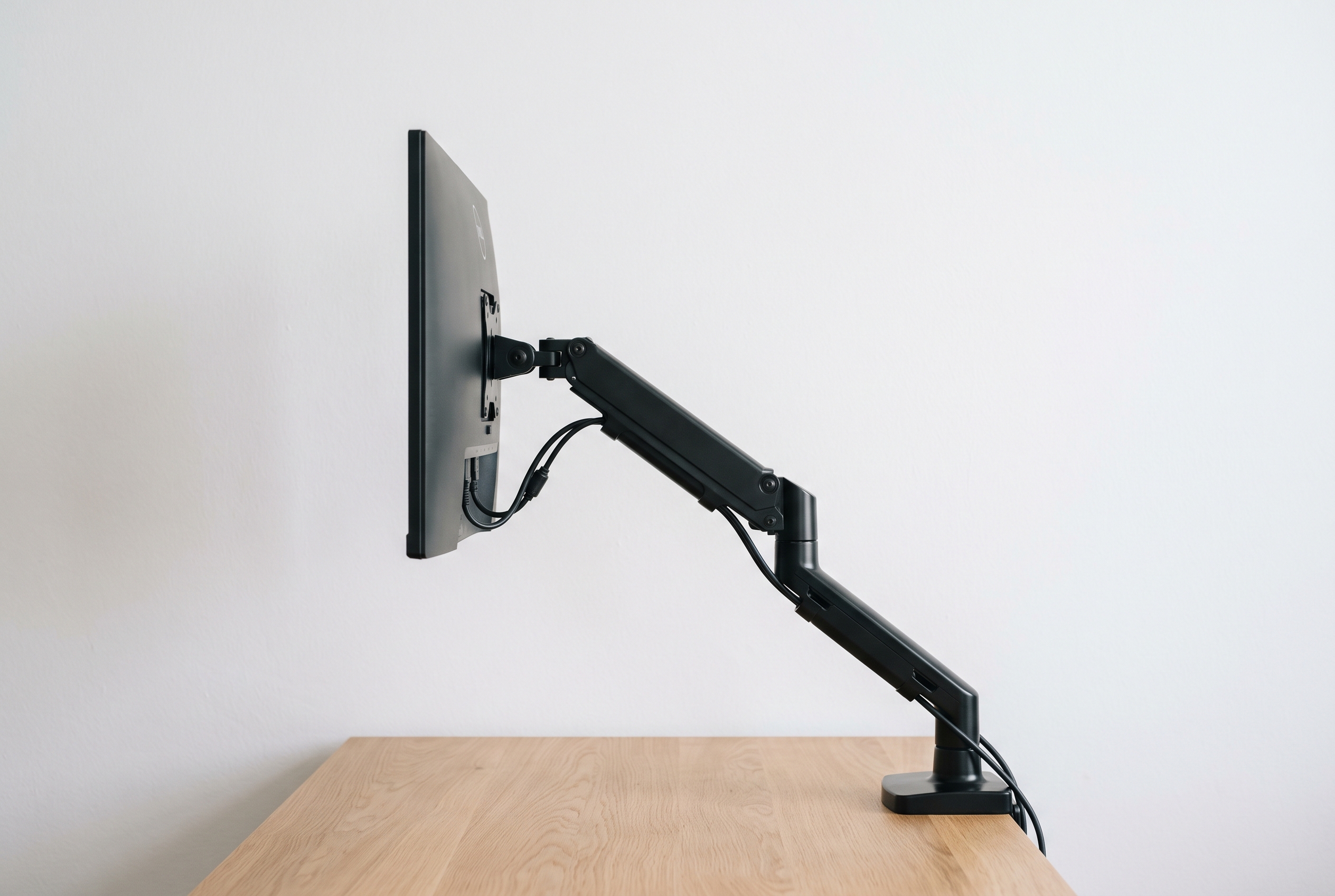 Single monitor arm holding a display