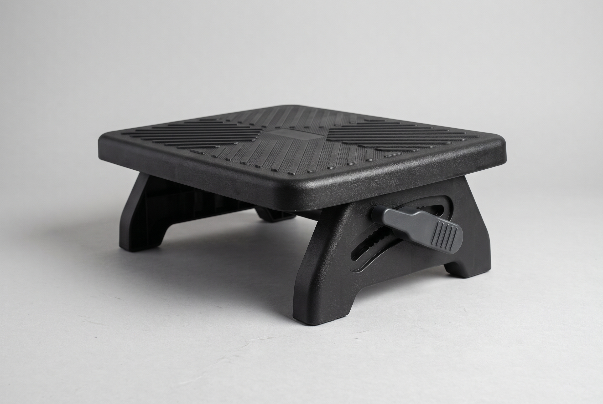 Plastic adjustable footrest with height lever