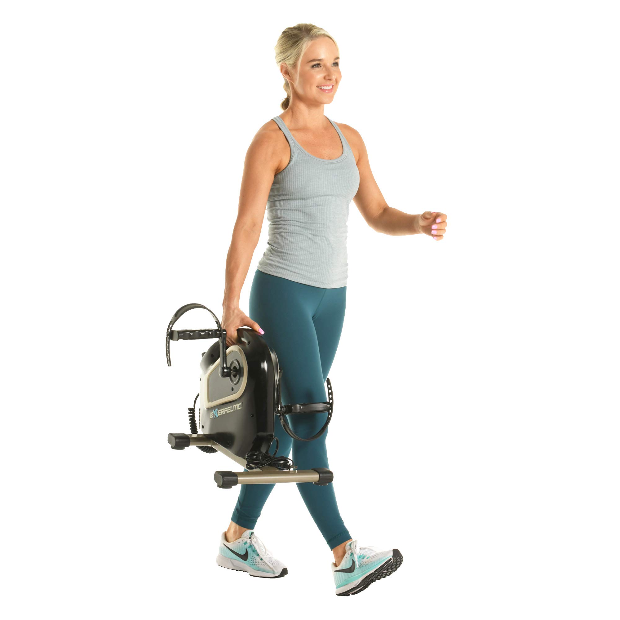 Woman carrying a compact under-desk pedal exerciser with a built-in carry handle